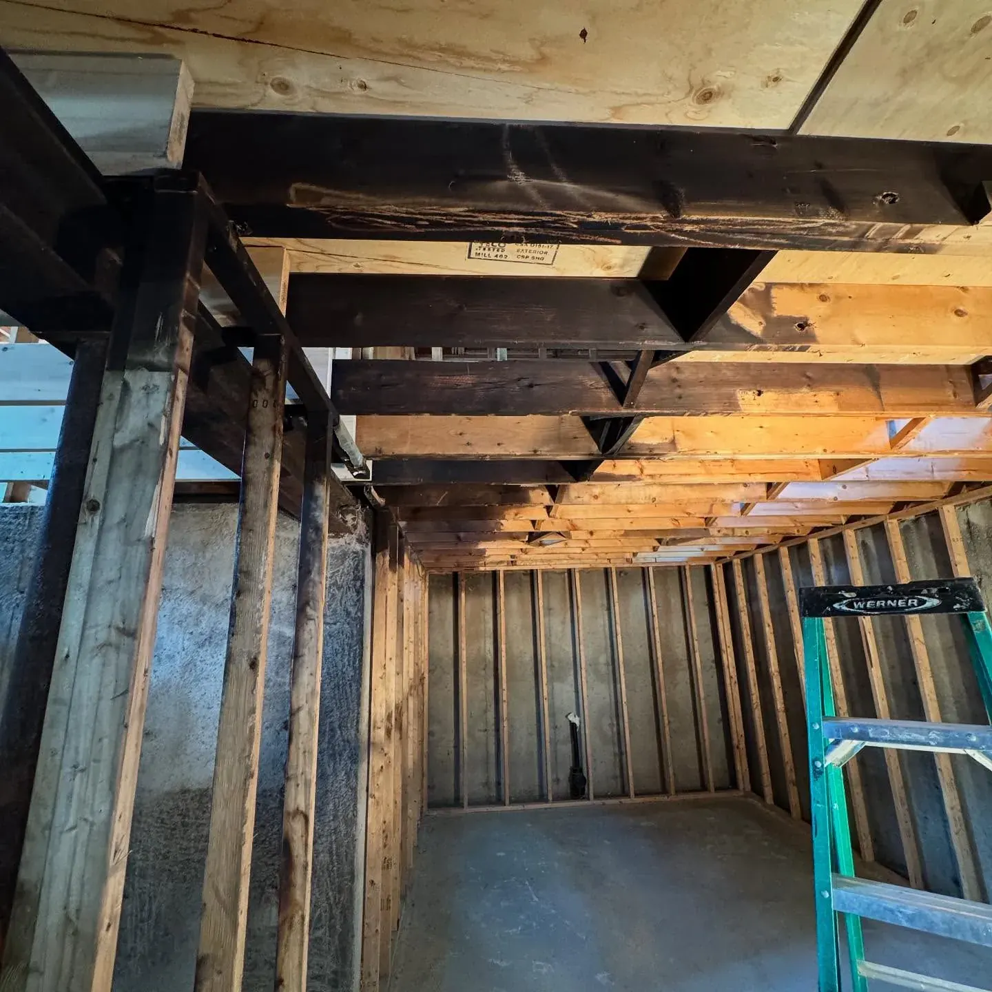 Dry ice blasting removing smoke and char from fire-damaged wood framing in the GTA