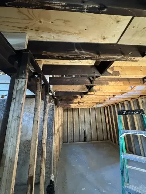 Wood framing cleaned back to bare grain