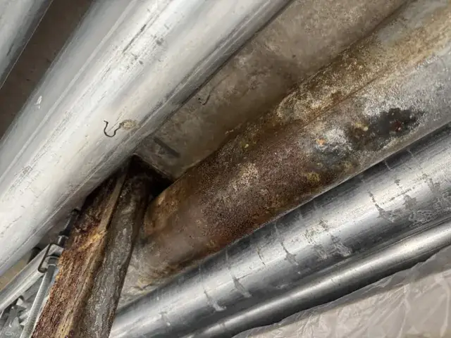 Corroded pipe runs before treatment