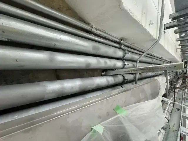 Industrial steel pipes stripped of rust and coatings to bare metal