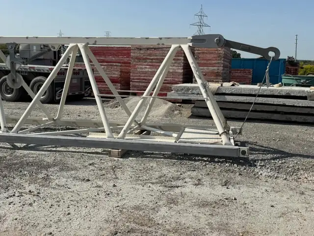 Overhead steel structure prepped by sandblasting