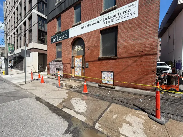 Exterior pressure washing a Toronto brick storefront