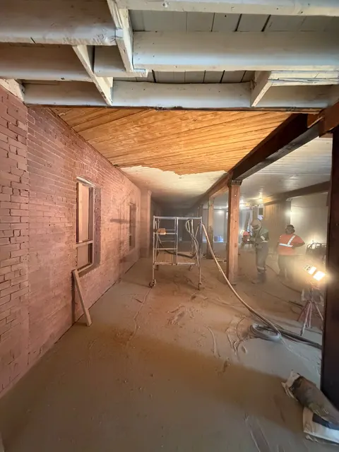Dustless sandblasting inside a Toronto heritage storefront