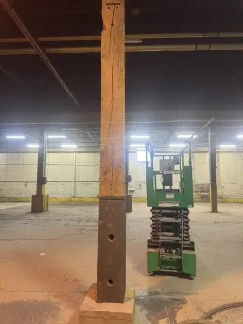 Warehouse steel beams cleaned by mobile sandblasting