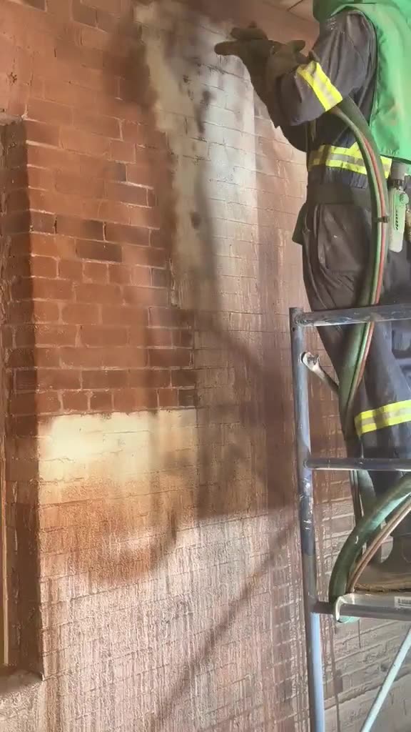 Dustless sandblasting paint off interior heritage brick in Toronto